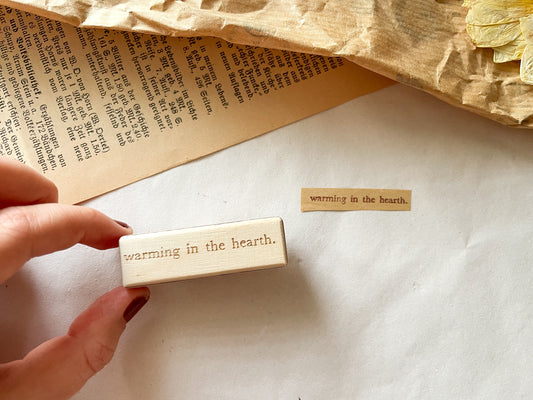 Holzstempel "warming in the hearth."