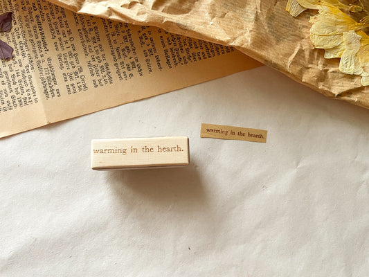 Holzstempel "warming in the hearth."